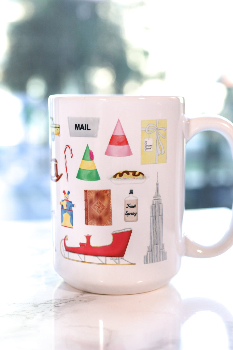 Elf mug. Buddy's signature coat and hat, Jovi's elf hat, maple syrup, fruit spray, the Empire State Building, the Rockefeller Center Christmas tree, the infamous Jack in the Box and raccoon who doesn't want a hug, Buddy's to do list, Mr. Narwhal and Arctic Puffin, the Clausometer, VCR full of cookies, Buddy's spaghetti, handmade rocking horse, shiny mailroom bins, Santa's sleigh and book of names and wishes, and the infamous yellow cabs that don't stop