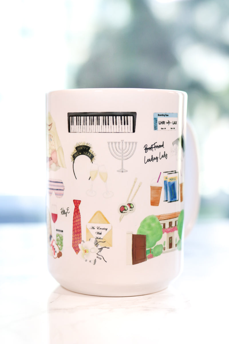 The Holiday movie Christmas mug. Iris's cottage in Surrey, Amanda's house in LA, hot chocolate with five marshmallows, the girls' tent, Frappuccinos with a little dollop and big dollop, a night with Arthur invitation and his tie, Arthur's Oscar, Arthur's orchid corsage for Iris, Amanda's sleep mask, Miles's keyboard, Iris's Mini Cooper, Berry Kiss lipstick, and more!