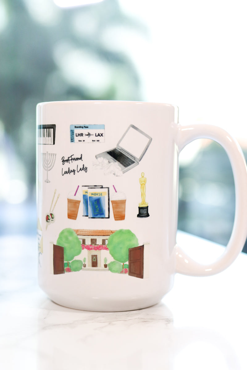 The Holiday movie Christmas mug. Iris's cottage in Surrey, Amanda's house in LA, hot chocolate with five marshmallows, the girls' tent, Frappuccinos with a little dollop and big dollop, a night with Arthur invitation and his tie, Arthur's Oscar, Arthur's orchid corsage for Iris, Amanda's sleep mask, Miles's keyboard, Iris's Mini Cooper, Berry Kiss lipstick, and more!
